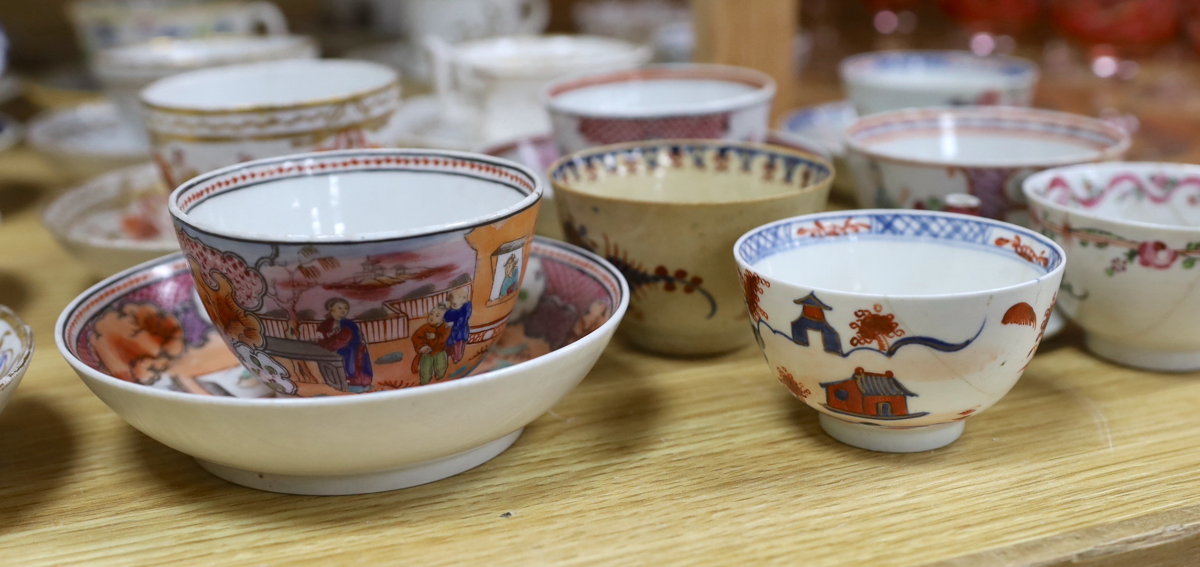 Collection of 18th/19th century English porcelain tea and coffee cups, bowls and saucers, some with hand painted and gilded decoration, the largest 15cm in diameter